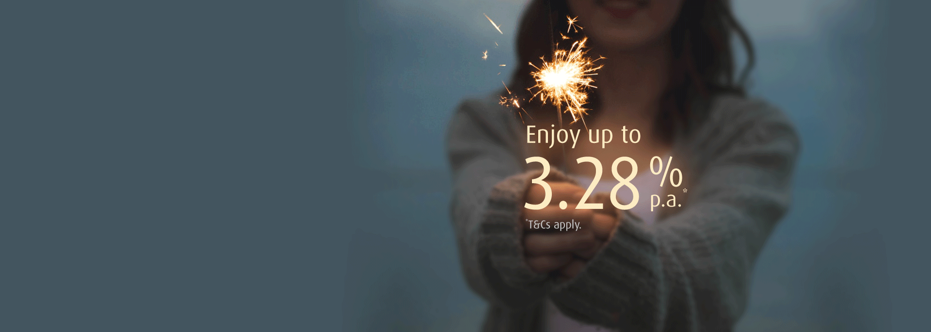 Text 'Enjoy up to 3.28% p.a.' over background of young woman holding a lit sparkler